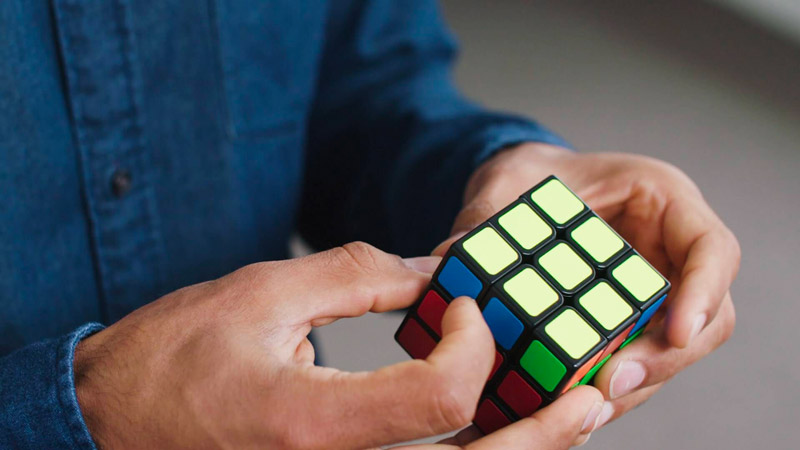 Man Solving Rubix Cube