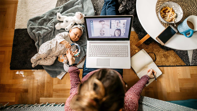 Multitasking Mom Working at Home