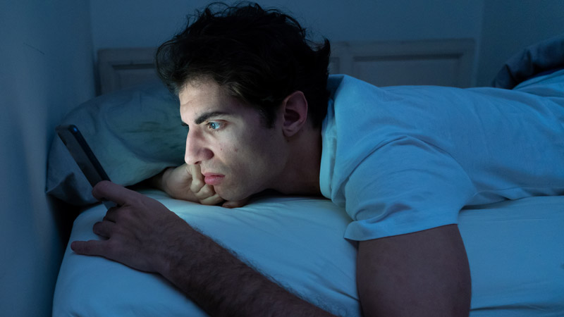 Sleepless Man Browsing Social Media