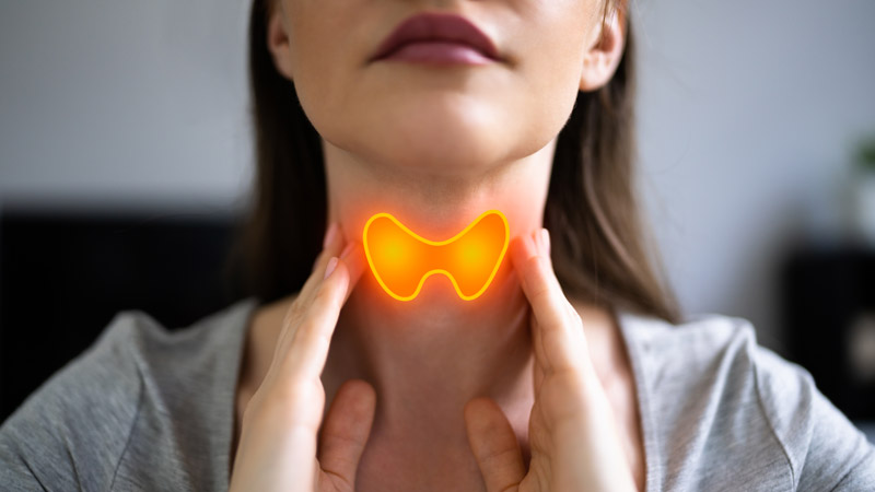 Woman Massaging Her Thyroid Gland